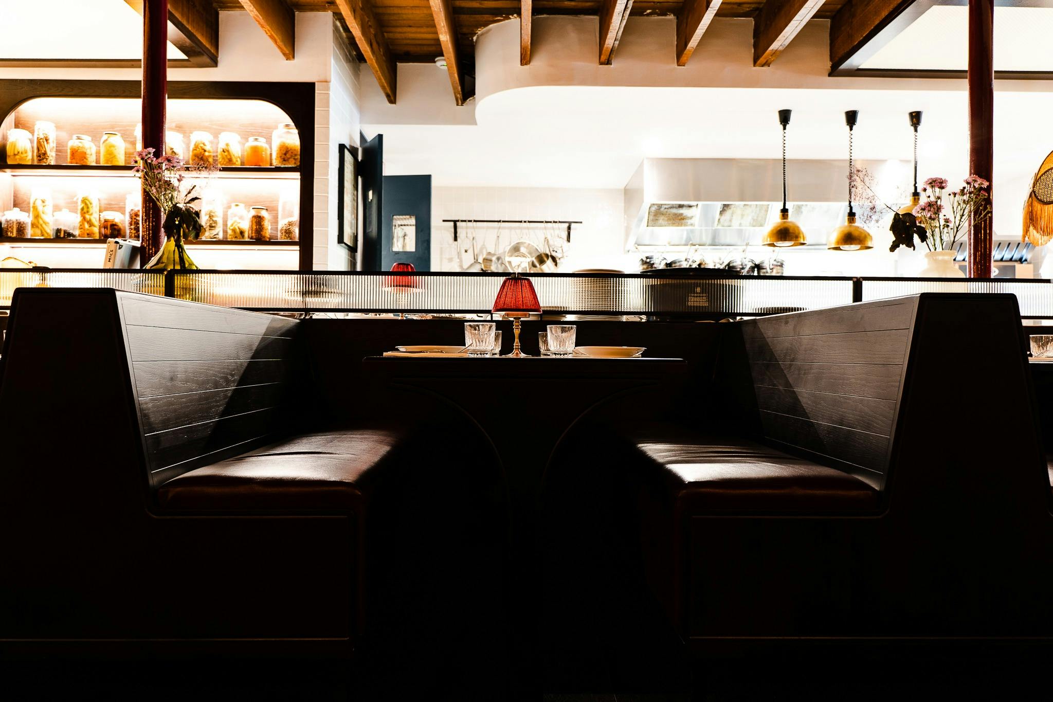 Booth seating with a view of the kitchen